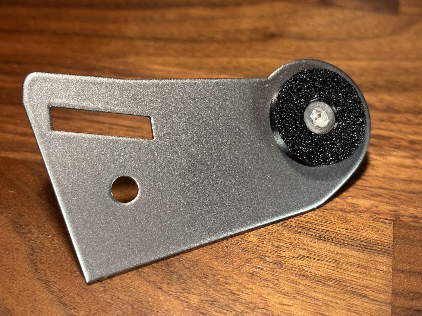 FlowState Clutch Stop bracket, angled view showing the mounting slot and stop